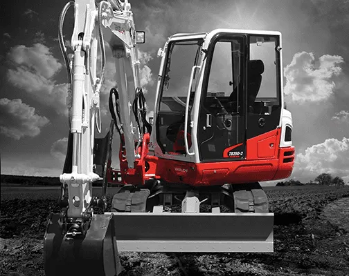Takeuchi TB250-2 compact excavator digging on site