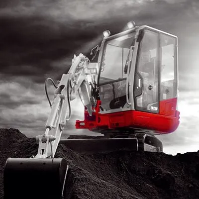 Takeuchi TB230 compact excavator working on site