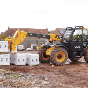 JCB 531-70 telehandler moving building blocks on site