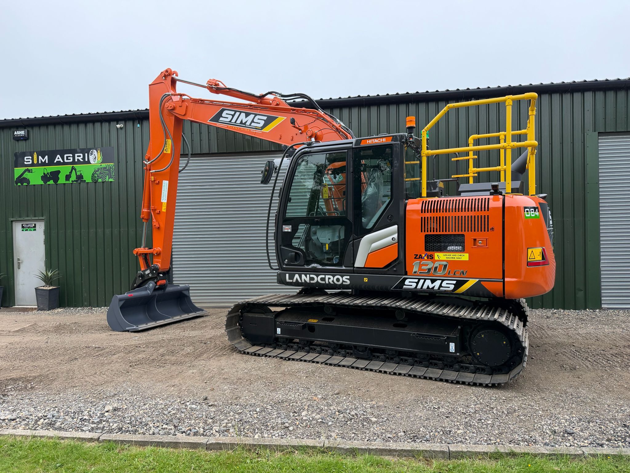 Orange Hitachi excavator ready for plant hire in Chelmsford