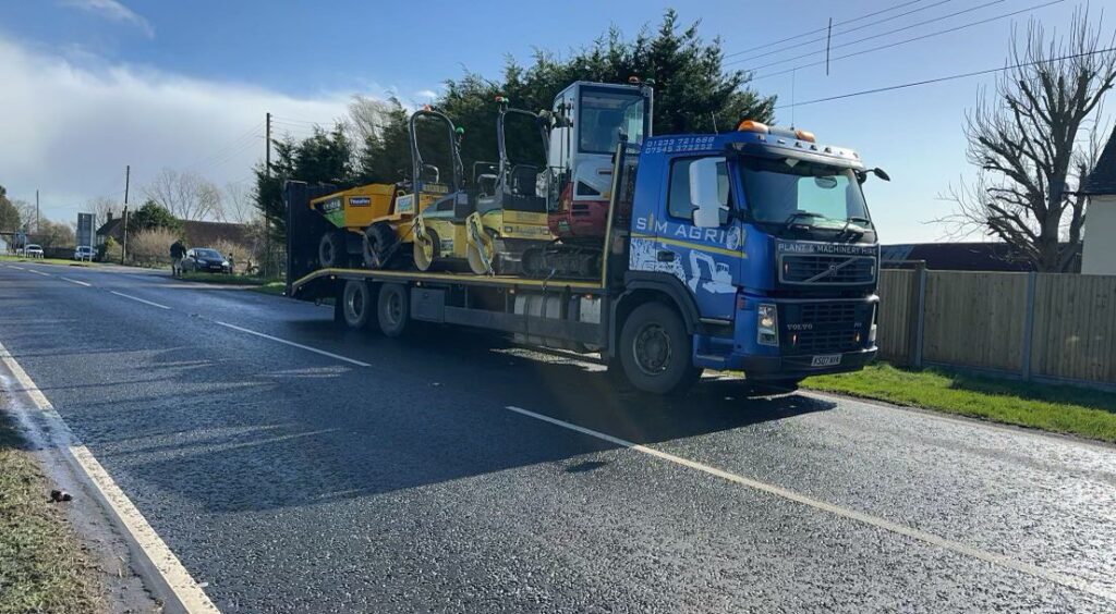 Sims low-loader carrying road rollers for excavator and equipment hire in the UK