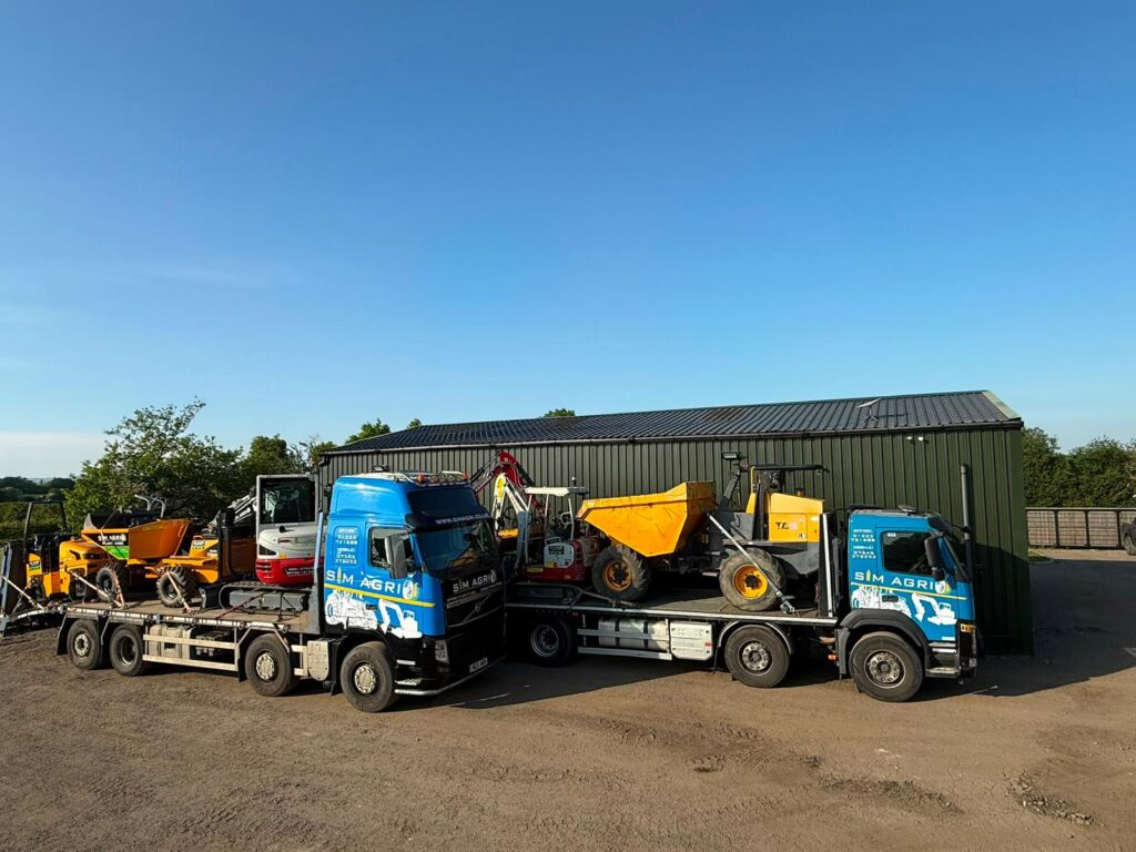 Sims lorries and low-loaders parked in the plant hire yard for the groundworks machinery available in the UK