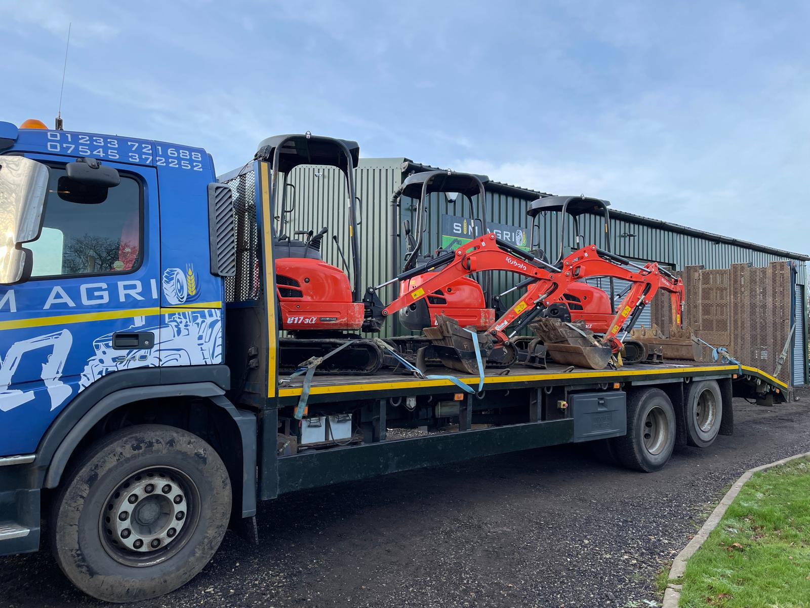 Sims lorry carrying mini excavators for plant hire in Chelmsford