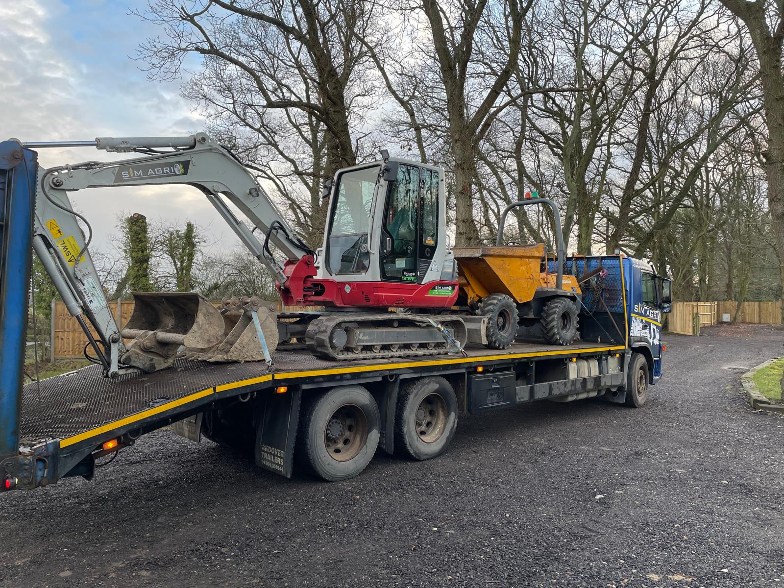 Low-loader carrying excavators for plant hire in Brighton