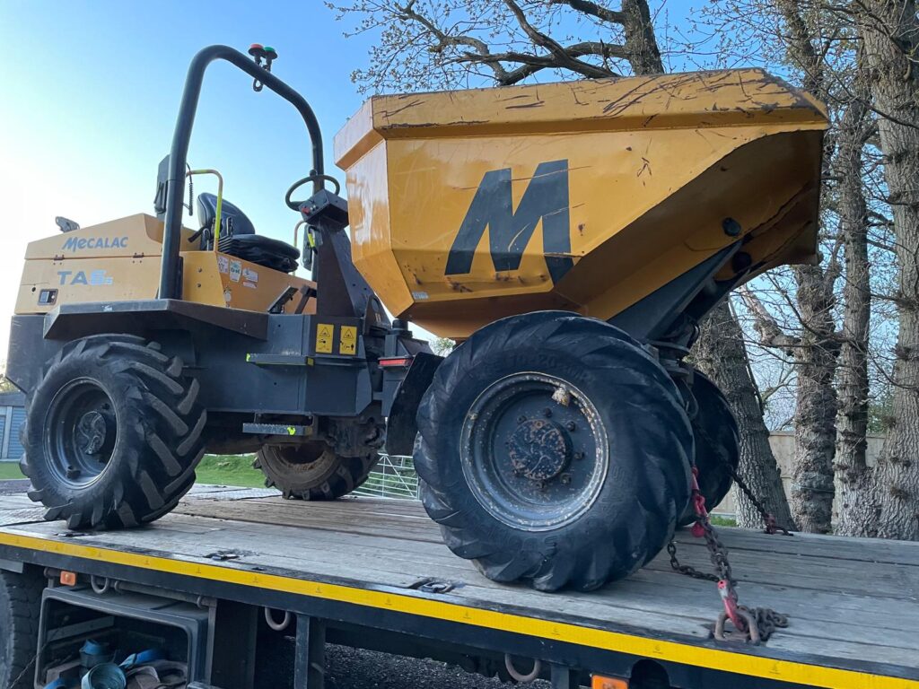 Messersi site dumper secured to a transport trailer for the plant hire gallery in the UK
