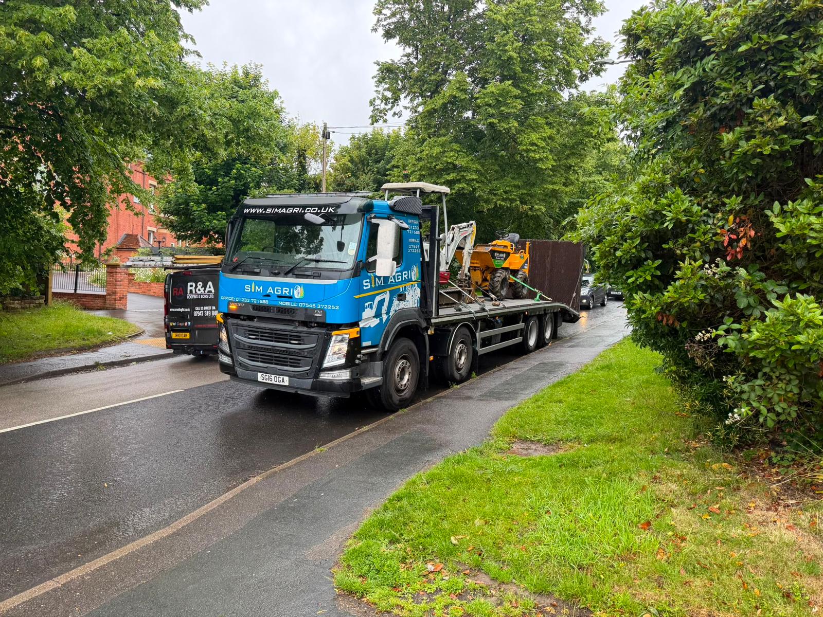 Sims Plant Hire lorry travelling along a leafy country lane