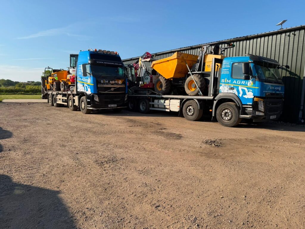 Sims plant transport fleet parked together at the depot for the plant hire projects across the UK
