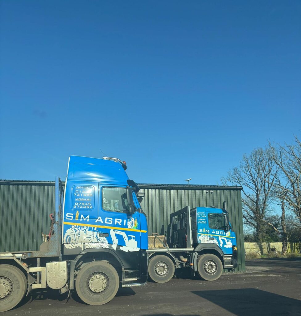 Blue Sims Plant Hire lorry parked in the sunshine for the excavator hire across the UK