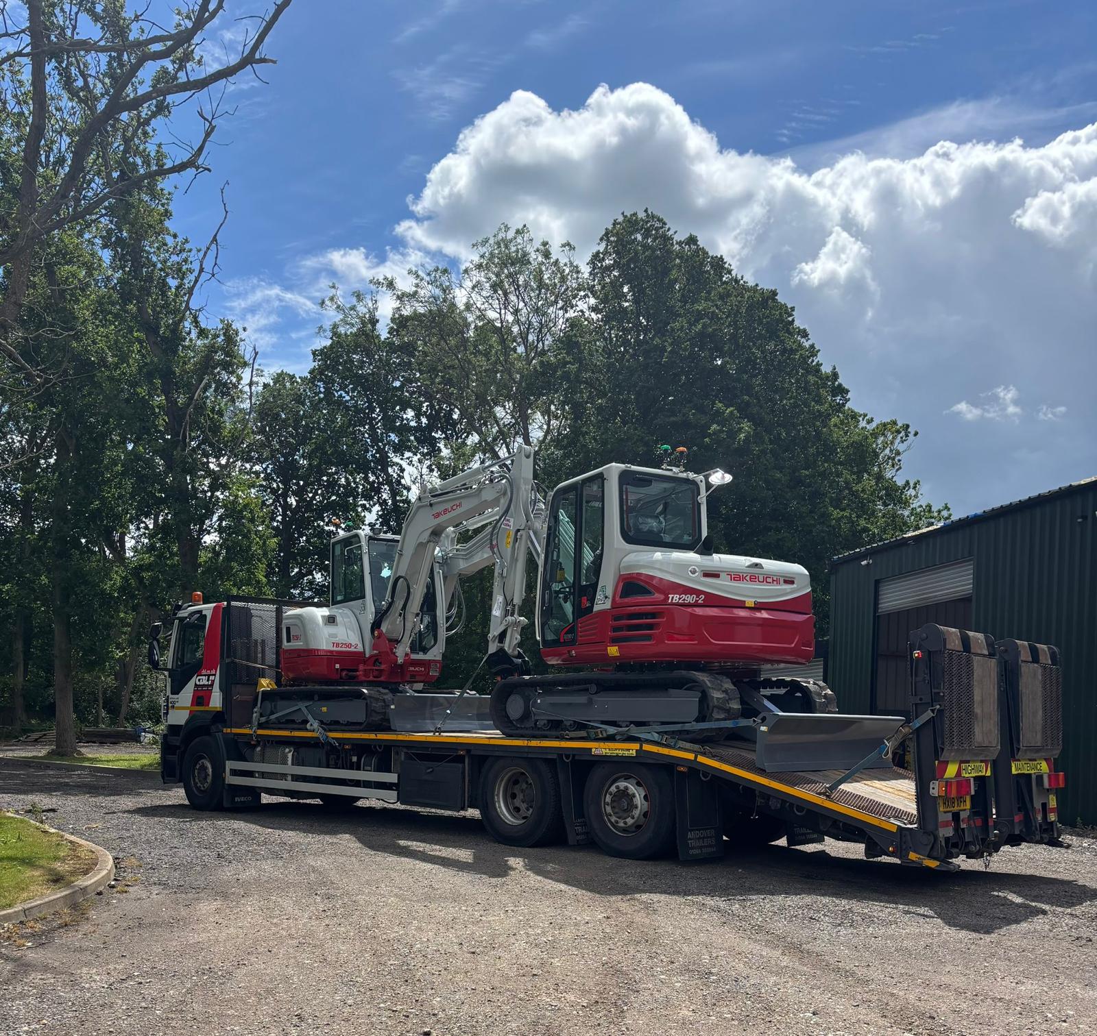 Sims low-loader carrying an excavator for plant hire in Leicester