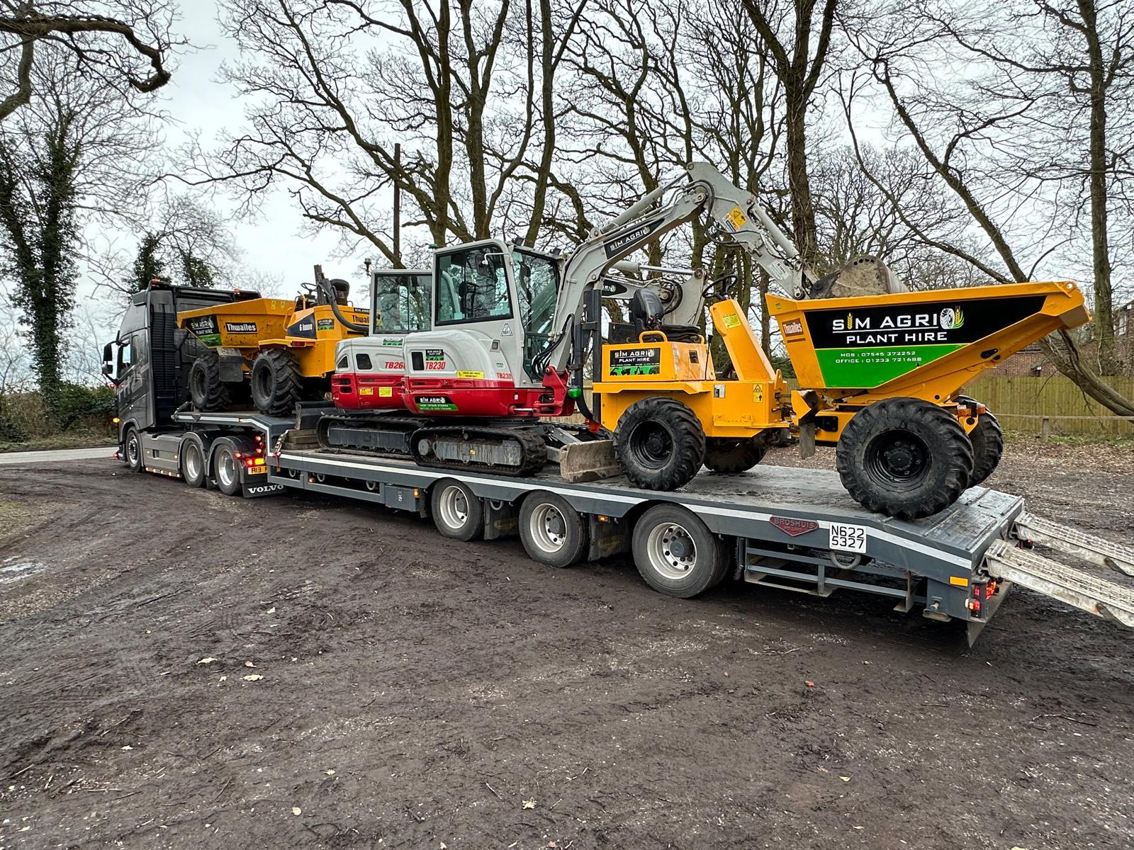 Low-loader carrying dumpers and an excavator for plant hire in Nottingham