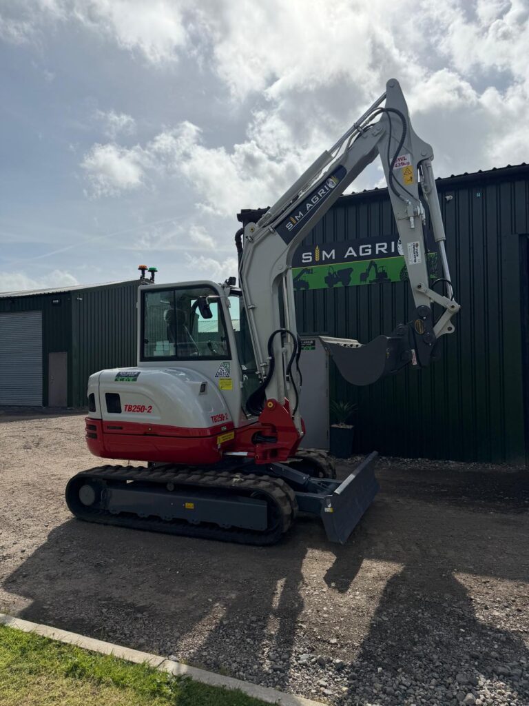 Takeuchi compact excavator parked beside the Sims depot for the excavator hire across the UK