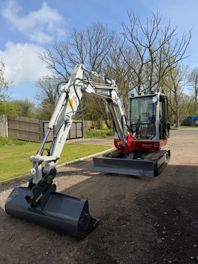 Takeuchi excavator with extended boom for plant hire in Norwich