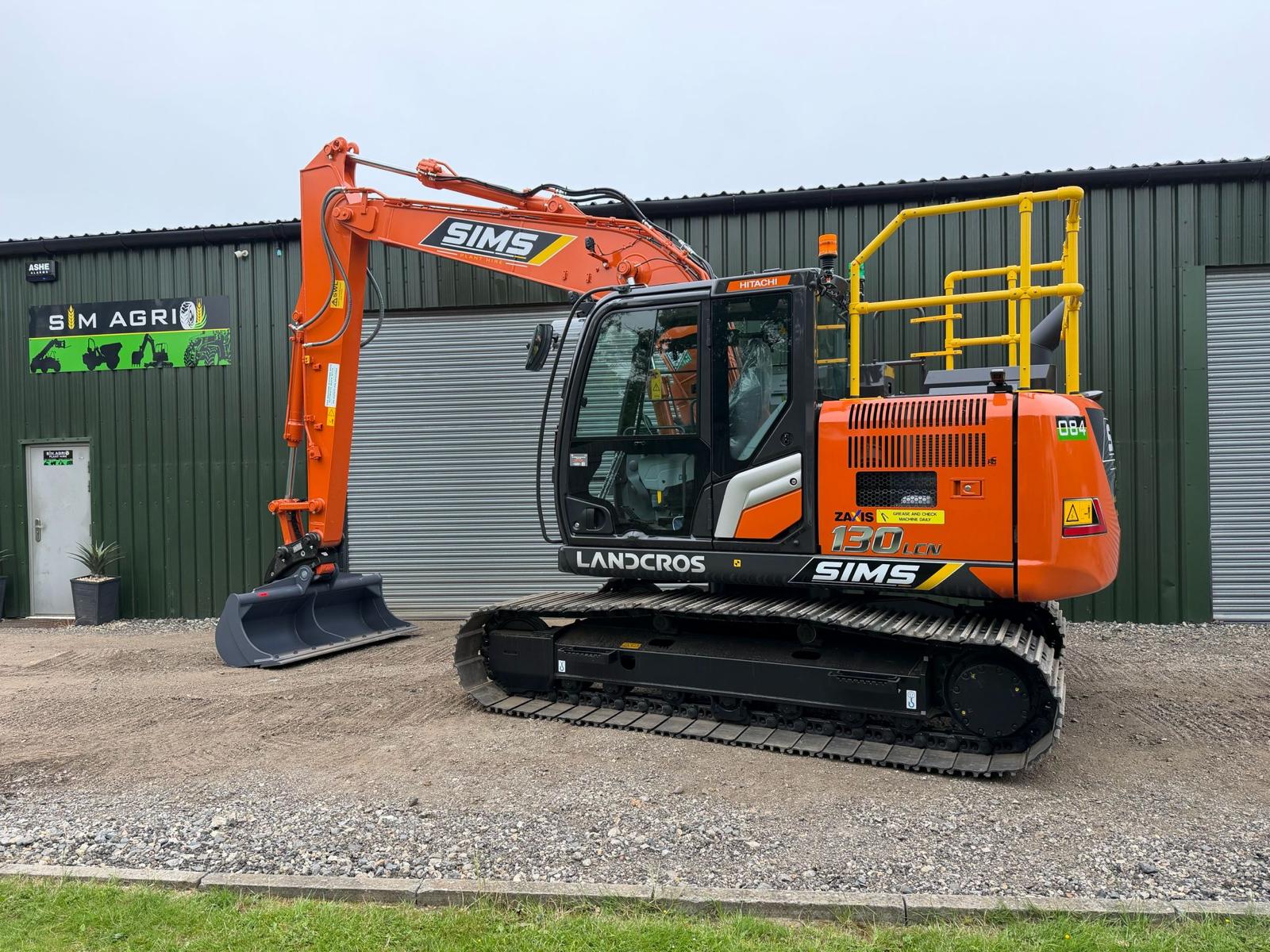 Orange Sims excavator for plant hire in the UK